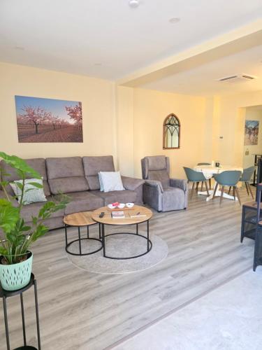 a living room with a couch and a table at Casa Rosa in Pinoso