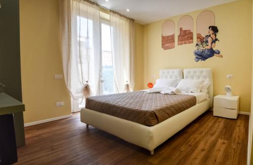 a bedroom with a bed and a large window at Le Veneri Del Golfo in La Spezia