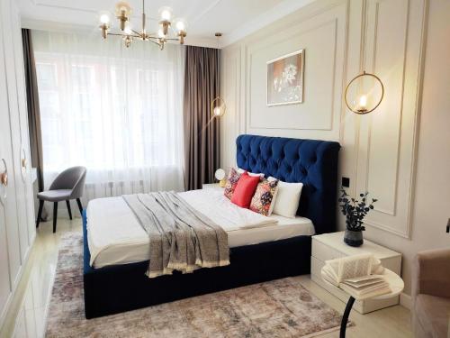 Ένα ή περισσότερα κρεβάτια σε δωμάτιο στο Островок комфорта и современности