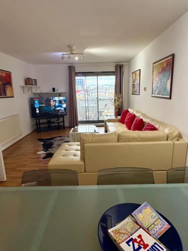 a living room with two couches and a television at 1 Bedroom Flat near Excel, O2, Canary Wharf - London in London