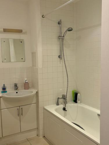 a bathroom with a sink and a tub and a shower at 1 Bedroom Flat near Excel, O2, Canary Wharf - London in London