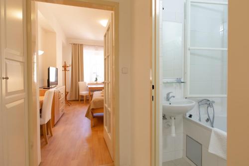 a bathroom with a sink and a toilet and a sink at St. Hubert House in Prague