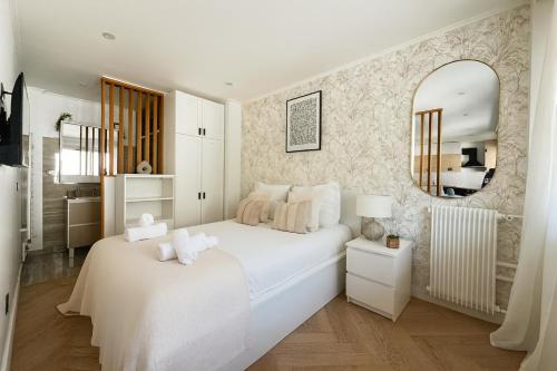 Postel nebo postele na pokoji v ubytování Appartement charmant au coeur du 16eme