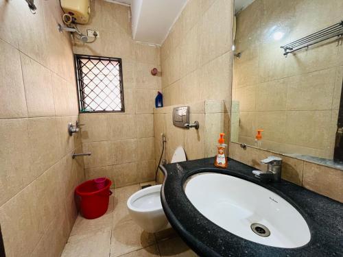 a bathroom with a sink and a toilet at 3bhk Villa calangute in Calangute