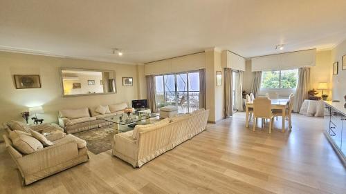 a living room with two couches and a table at STAY Charm Classic Apartment in Strovolos