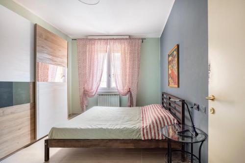 Ένα ή περισσότερα κρεβάτια σε δωμάτιο στο Appartamento tra Museo Ferrari, stazione e centro