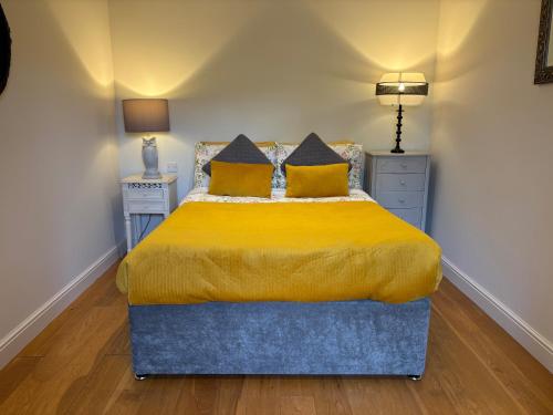 Ένα ή περισσότερα κρεβάτια σε δωμάτιο στο Gosfield Cartlodge Retreat