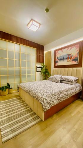 Postel nebo postele na pokoji v ubytování Okaeri Place - Messavirre Gardens Residences Bacolod