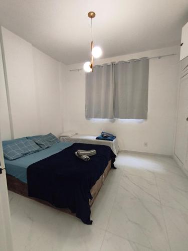 Ένα ή περισσότερα κρεβάτια σε δωμάτιο στο Centro, ap novo, coração de BH, conforto e acesso