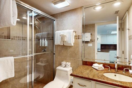 a bathroom with a shower and a toilet and a sink at Ocean Vista #102 in South Padre Island
