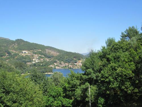 a view of a lake in the middle of a mountain at Residencial Do Rita em Rio Caldo in Geres