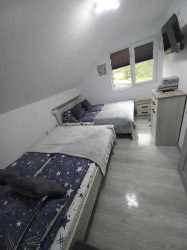 Ένα ή περισσότερα κρεβάτια σε δωμάτιο στο Copacabana Sinteu