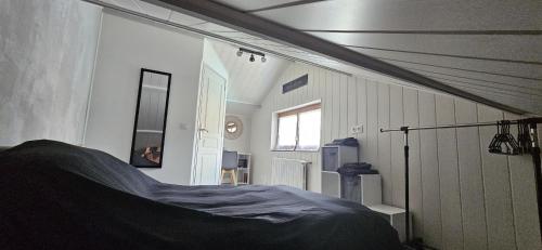 a bedroom with a bed in a room at La cherpée in Lhommaizé