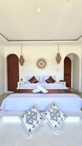 Ένα ή περισσότερα κρεβάτια σε δωμάτιο στο Batur Volcano Garden