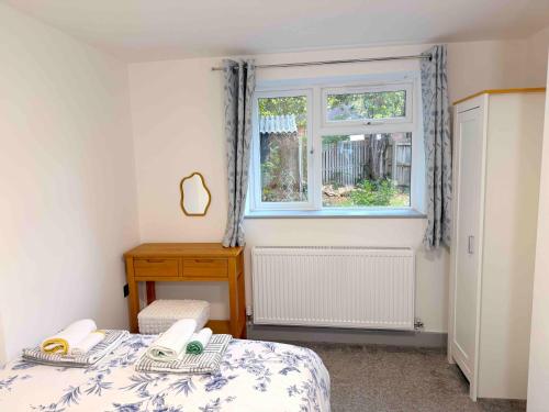 Ένα ή περισσότερα κρεβάτια σε δωμάτιο στο The Modern Muse