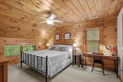 a bedroom with a bed and a wooden ceiling at Among The Trees in Vilas