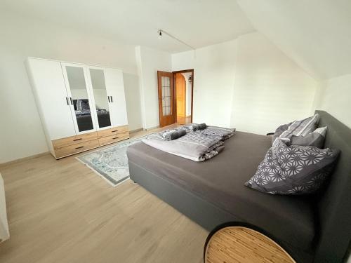 a bedroom with a large bed with pillows on it at Gemütliche Unterkunft 10 min von Linz entfernt 