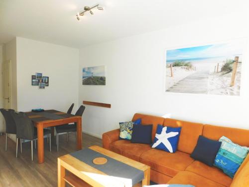 a living room with a couch and a table at FeWo "Hafenblick" in Barth