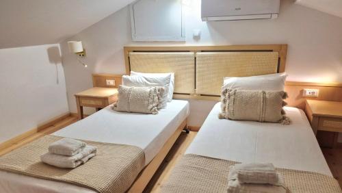 En eller flere senge i et værelse på SITIA CITY CENTER luxury apartment