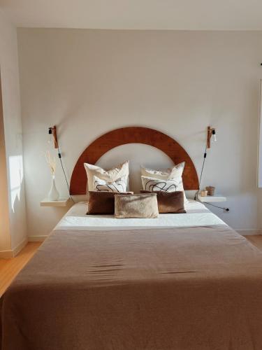 a bedroom with a large bed with pillows on it at Central Lisbon Apartment in Mouraria in Lisbon