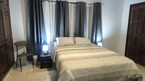 Una cama o camas en una habitación de Nueva Acropolis Sede SPS