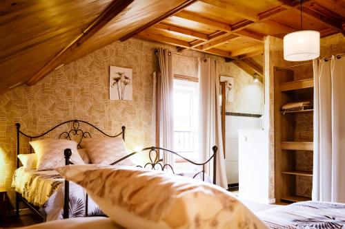 a bedroom with two beds and a window at GITE D'HAUTEVESNES in Hautevesnes