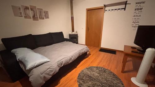 En eller flere senge i et værelse på Casinha no coração do Oeste - Ventosa