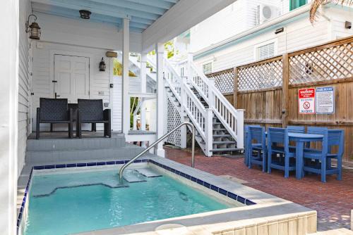 a swimming pool on the porch of a house at Sweet Caroline in Key West