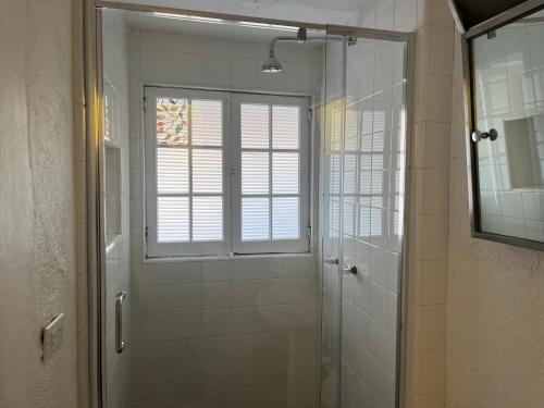 a bathroom with a shower and a window at Magic Castle Unit 7 in Santa Clarita