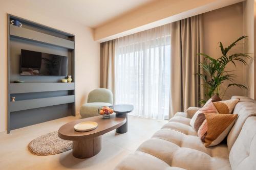 a living room with a couch and a table at City Core Katerini, Platea Double in Katerini