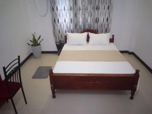 Ένα ή περισσότερα κρεβάτια σε δωμάτιο στο S & S Home Stay