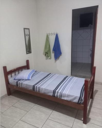 Ένα ή περισσότερα κρεβάτια σε δωμάτιο στο Pousada Central