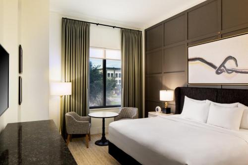 a hotel room with a bed and a window at Andaz Savannah, By Hyatt in Savannah