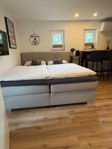 a bedroom with a large bed in a room at LippeStay - Modernes Apartment für 2 in Werne an der Lippe