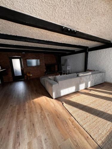 a living room with a couch and a table at Aby Wohnungen in Rosenheim
