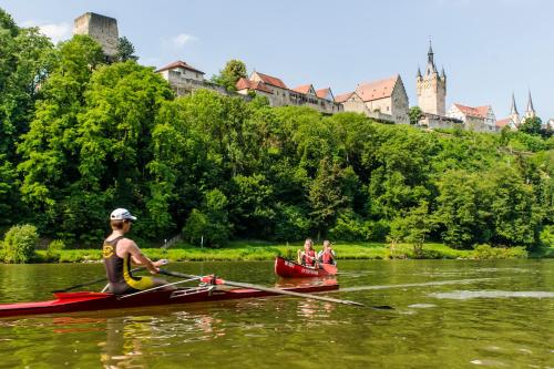people on a boat in the water at Gästehaus Fernblick in Bad Wimpfen