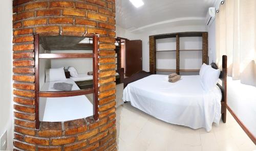 Postel nebo postele na pokoji v ubytování Casa do Encantado