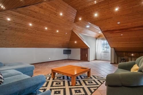 a living room with two couches and a coffee table at Ocean Hill View By Zest&Guest in Câmara de Lobos