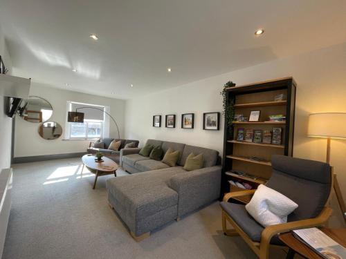 a living room with a couch and a table at Spacious City Centre Property in Lancaster