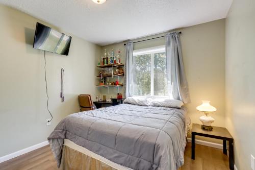 a bedroom with a bed and a window at 1 Mi to Shops and Cafes Updated Cassville Home! in Cassville