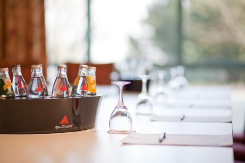 a group of bottles of beer in a container on a table at Hotel am Rosengarten in Bad Wimpfen
