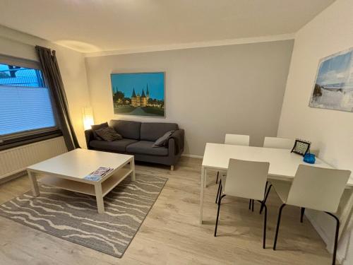 Posezení v ubytování Ferienwohnung zwischen Lübeck und Travemünde