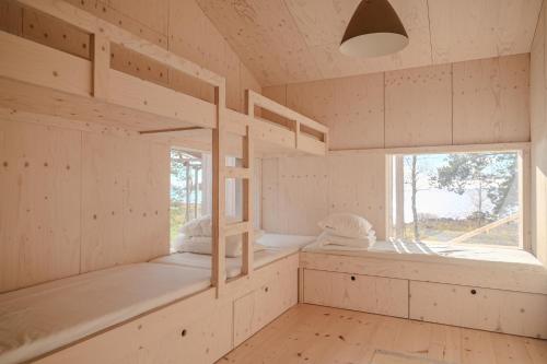 Postel nebo postele na pokoji v ubytování Pauha - Aurora Nights at the Seaside Cabin