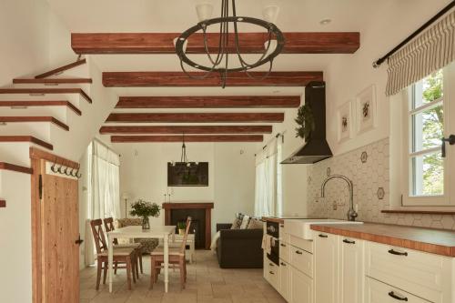 a kitchen with a table and a dining room at Nad svatým Kiliánem 