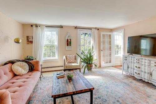 a living room with a couch and a coffee table at Lambertville Retreat - Walk to Shopping and Dining! in Lambertville