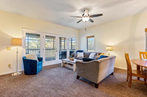 a living room with a couch and chairs and a table at Beaches and Birdies in North Myrtle Beach
