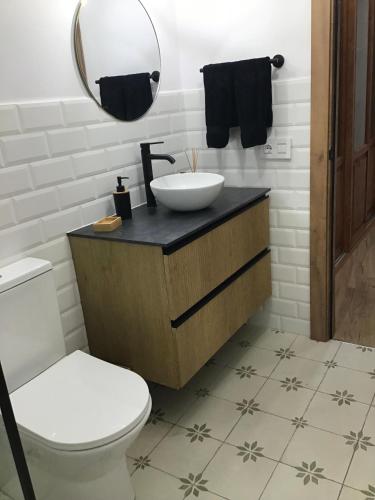 a bathroom with a sink and a toilet at Casa Garnier in Santa Cruz de la Palma
