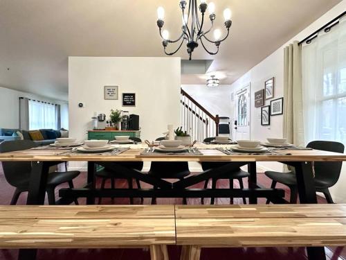 a dining room with a wooden table and chairs at Pocolonial Charming 4BR Mountain Retreat in Towamensing Trails