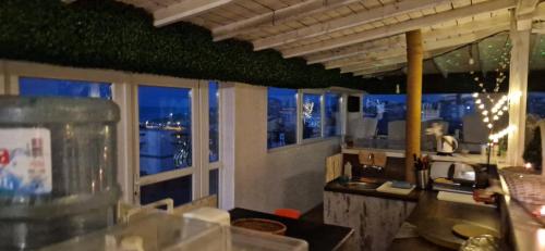a restaurant with a view of a city at night at HOUSEDENz in Chernomorets