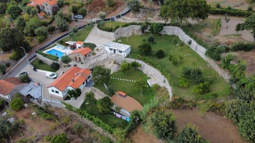 an aerial view of a house with a yard at Quinta da Estacao in Marco de Canaveses